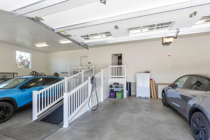 Spacious garage featuring concrete flooring and white walls