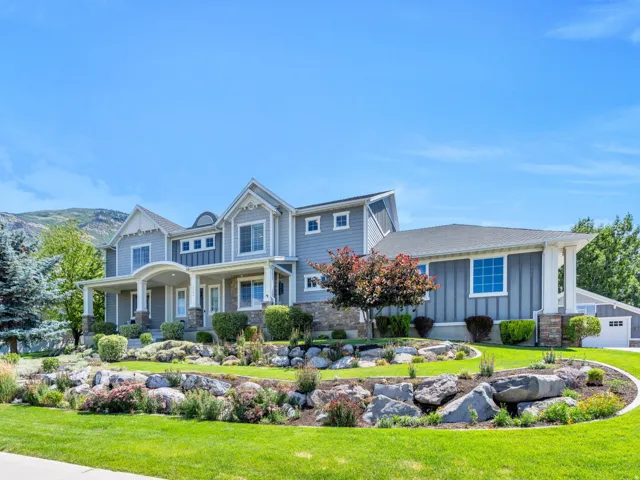 Contemporary residence featuring blue siding and white trim accents