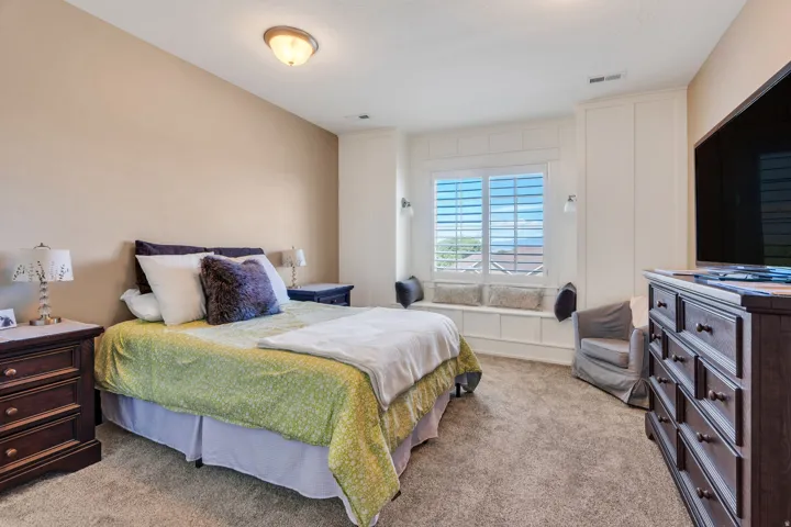 Recessed window seat with integrated storage and plantation shutters