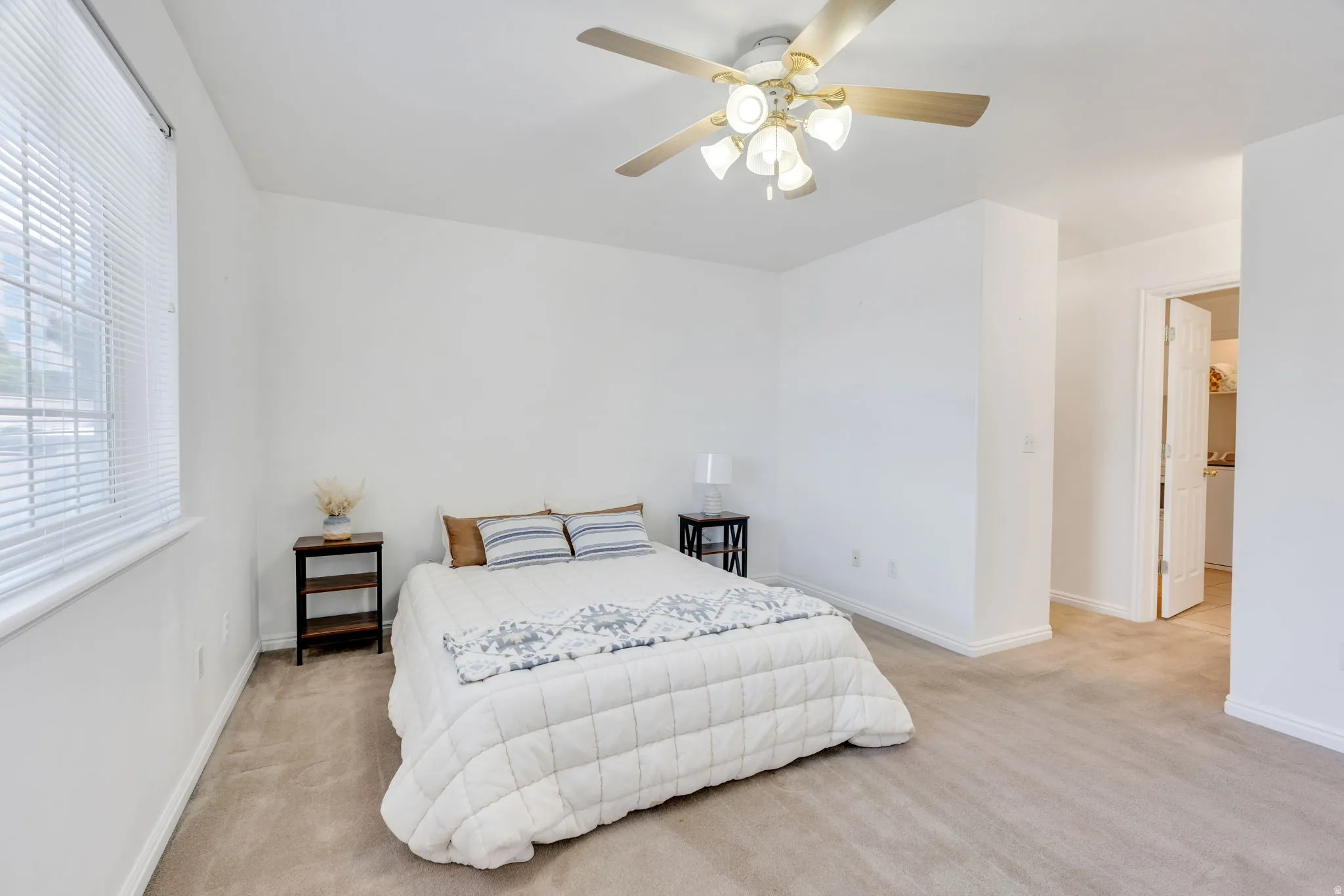 #2 Carpeted room featuring a ceiling fan with integrated lighting, a window with horizontal blinds, and a white paneled door