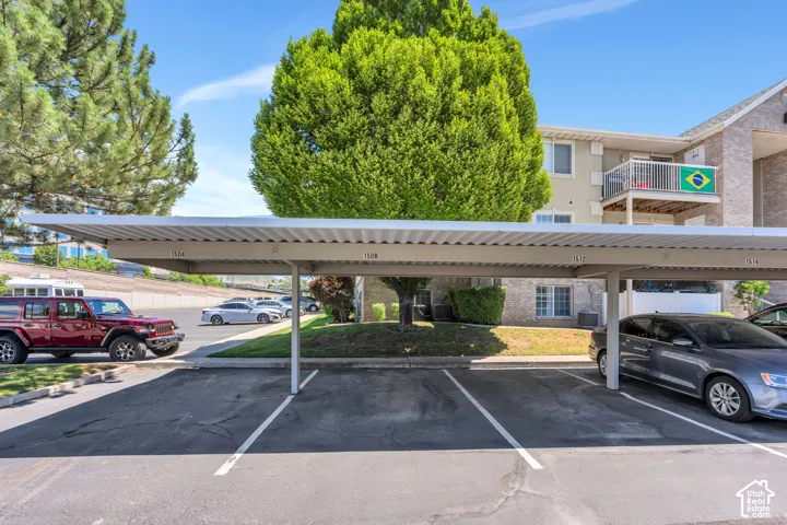 One Covered parking structure with individual numbered spaces