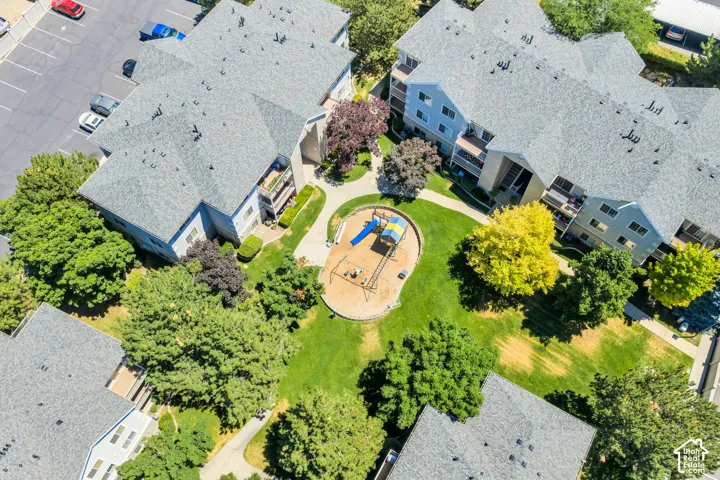 Aerial perspective of Central courtyard featuring a playground and surrounded by manicured green lawn and mature trees