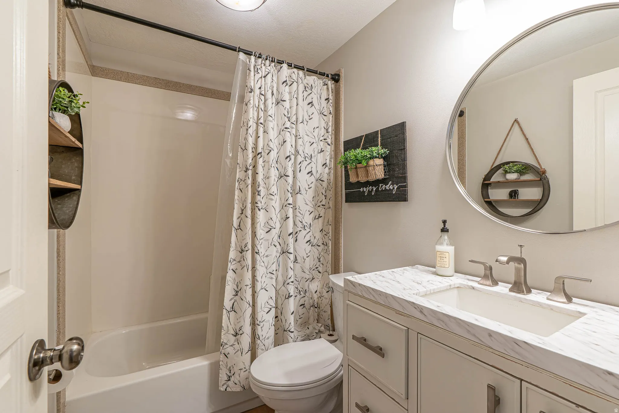 Adorable bathroom featuring a vanity with a white countertop and rectangular undermount sink