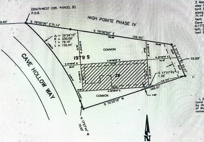 Plat Map measures apx (due to curve) .41 acres of land that surrounds this home.  The property has .11 acres deeded to it in which property taxes are paid and the surrounding .30 acres that is owned by the HOA is paid for through HOA dues, but enjoyed by