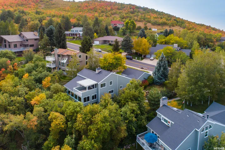 Expansive property featuring mature trees and lush landscaping