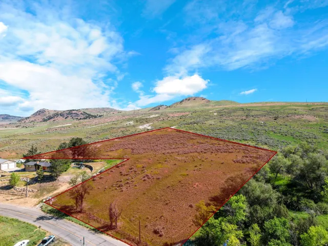 Expansive land parcel featuring varied topography and natural vegetation