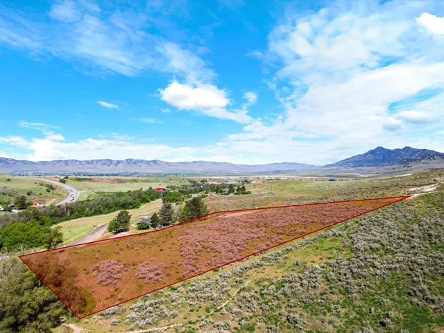 Expansive undeveloped parcel featuring varied topography and natural vegetation