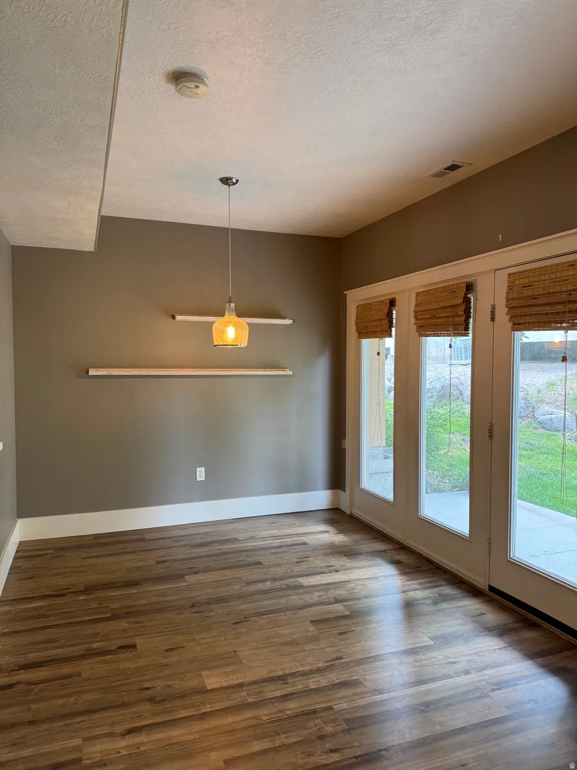 Lots of beautiful natural light from the large windows overlooking the serene backyard.
