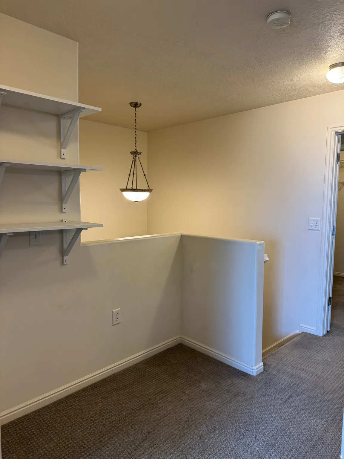 Loft area featuring built-in shelving