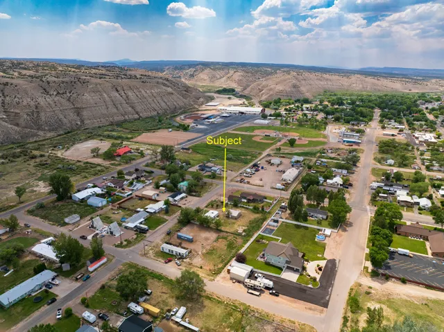 Aerial perspective showcasing a residential area with a single-family home