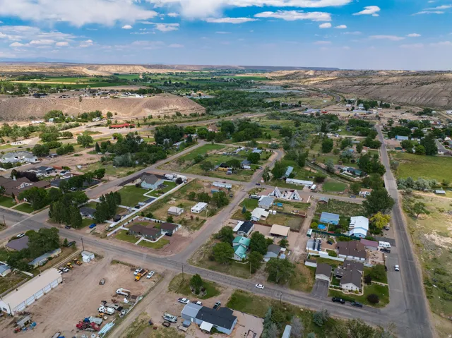 Aerial perspective showcasing a residential neighborhood with varied housing styles and mature trees