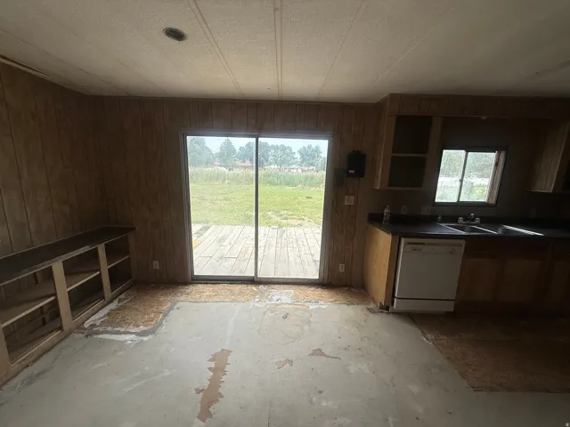 Sliding glass door opening to an outdoor deck, offering exterior access