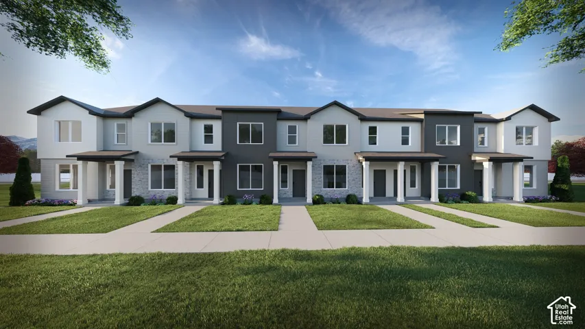 Modern townhome row featuring multi-toned siding, stone facade accents, and individual covered entryways with white columns