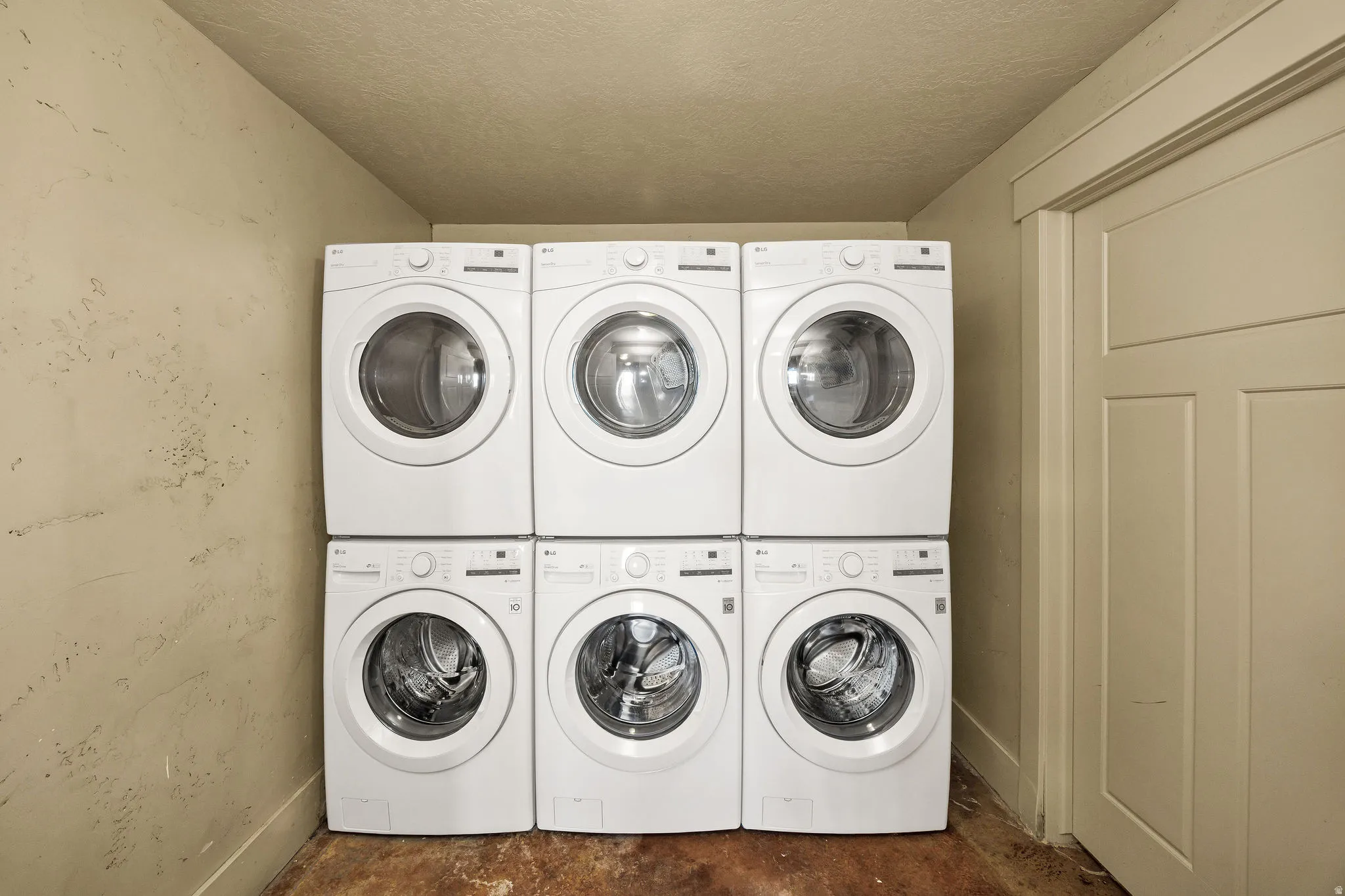 Six stacked front-loading washer and dryer units