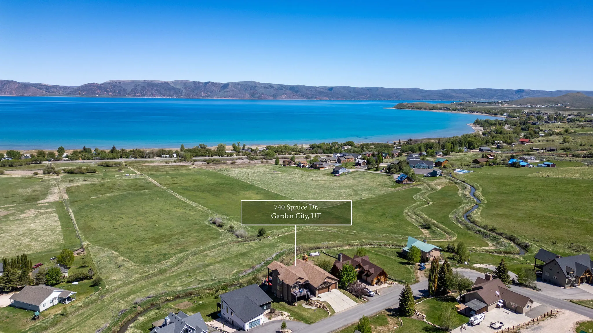 Aerial perspective showcasing a property surrounded by expansive green spaces