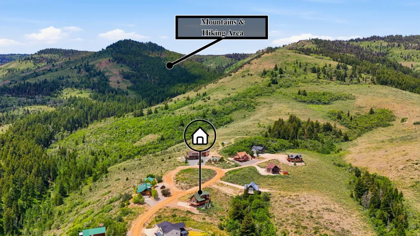 Mountainous terrain with natural landscaping and scattered residential structures
