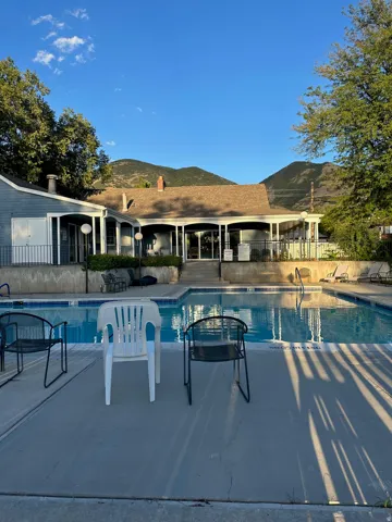 Outdoor swimming pool with integrated steps and a surrounding concrete deck