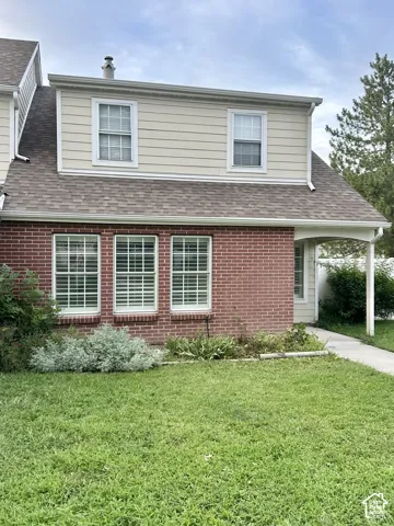 Brick and siding exterior with a shingled roof