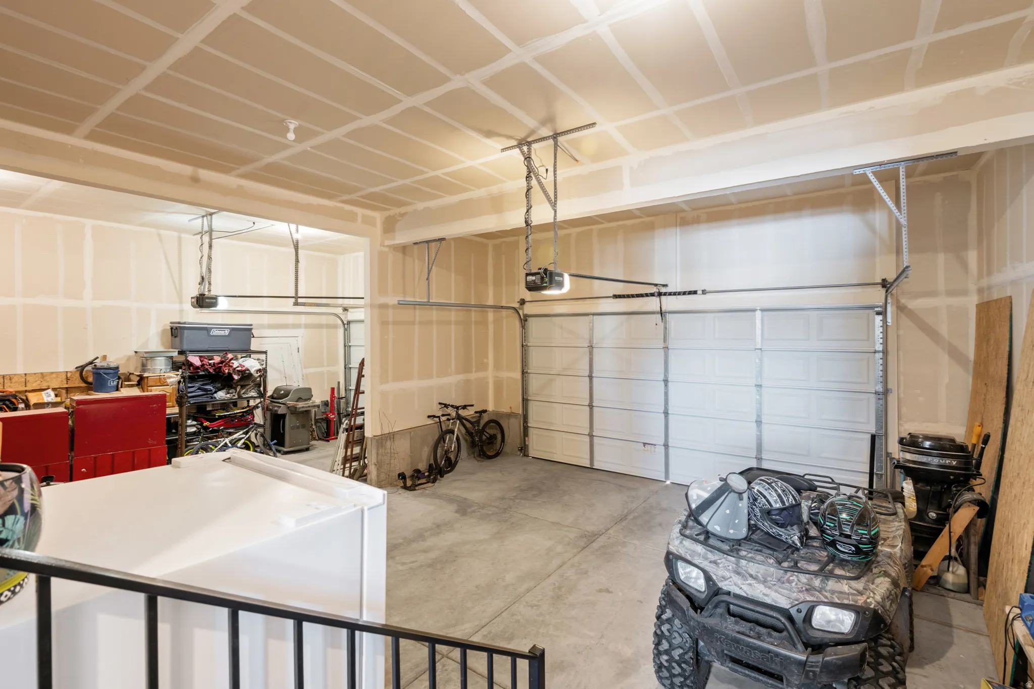Spacious garage featuring two overhead doors
