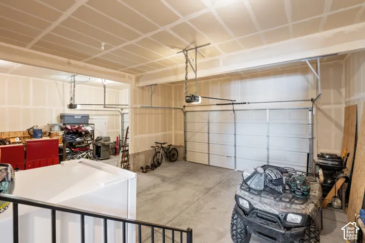 Spacious garage featuring two overhead doors
