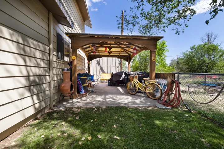 Covered patio featuring a solid wood pergola with a translucent roof