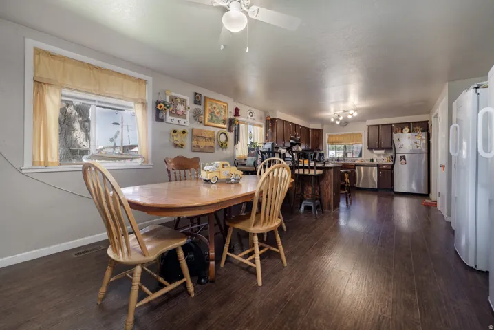 Open-concept living space with wood-finish flooring