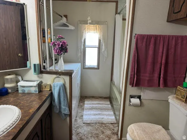 Bathroom vanity with a laminate countertop and an integrated sink basin