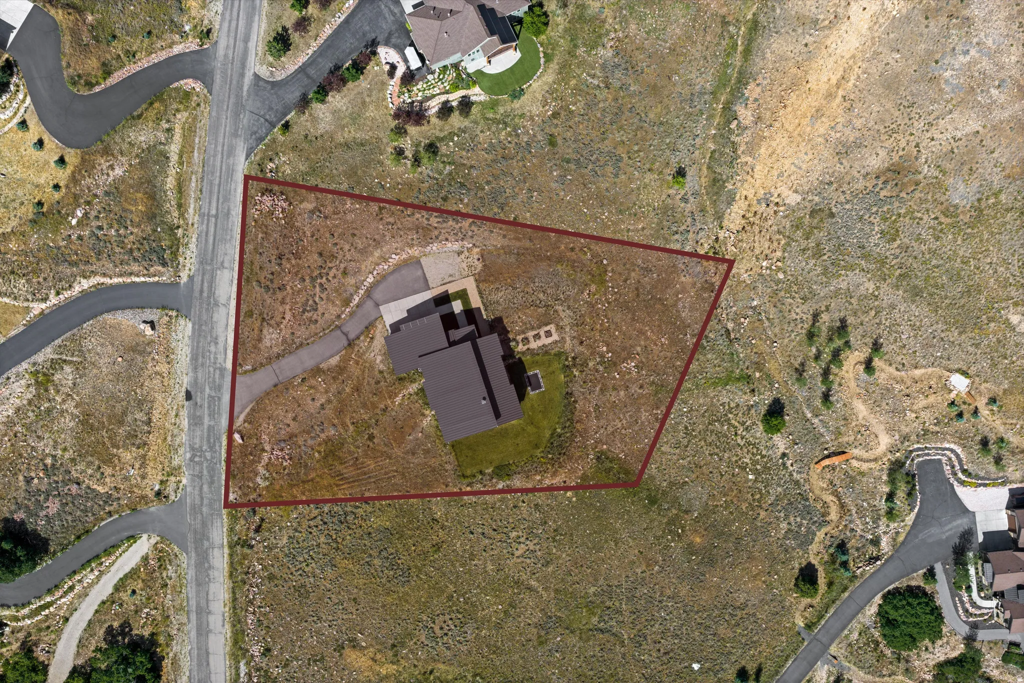 Aerial view showcasing a property with a distinct perimeter