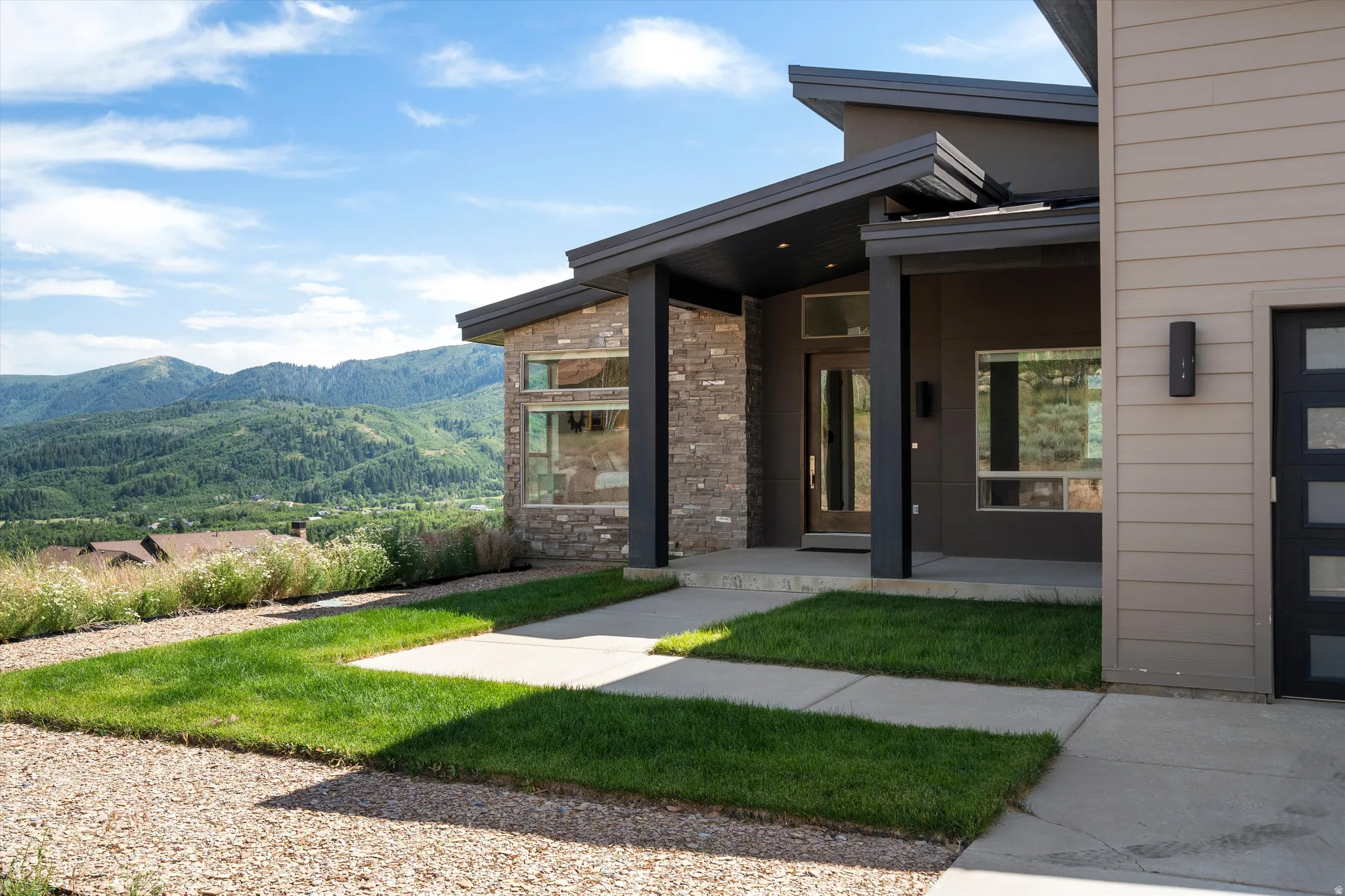 Modern architectural design featuring stone and horizontal siding