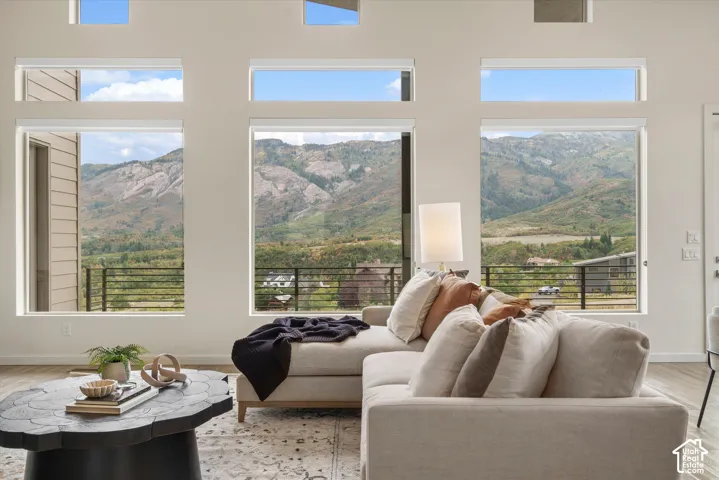 Expansive window wall with multiple large windows, offering mountain scenery