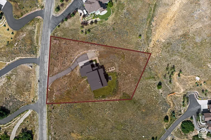 Aerial view showcasing a property with a distinct perimeter