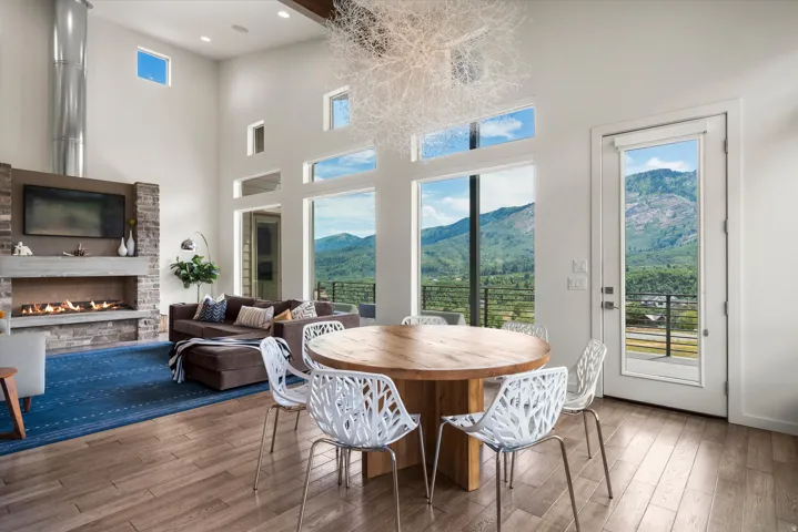 Spacious living area featuring high ceilings and extensive window walls
