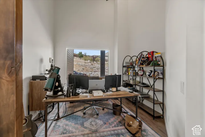 Dedicated room with a large window offering natural light and views of the arid landscape