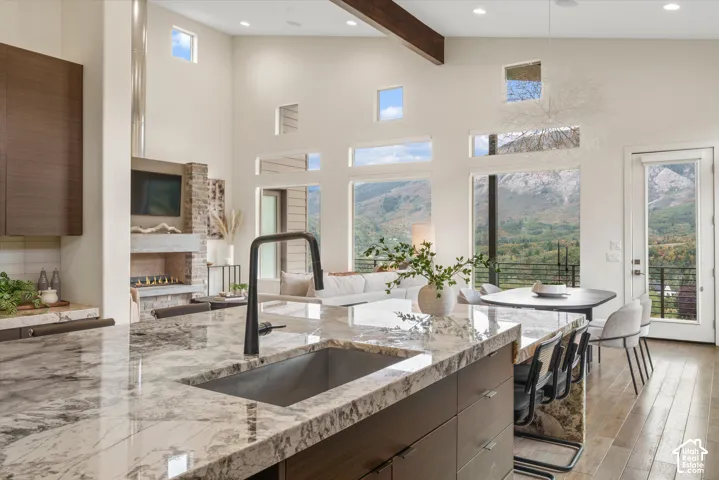 Kitchen island with a built-in sink and stone countertop