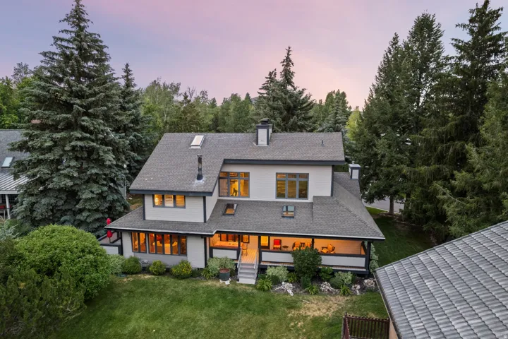 Modern architectural design with multiple rooflines, skylights, and a covered porch