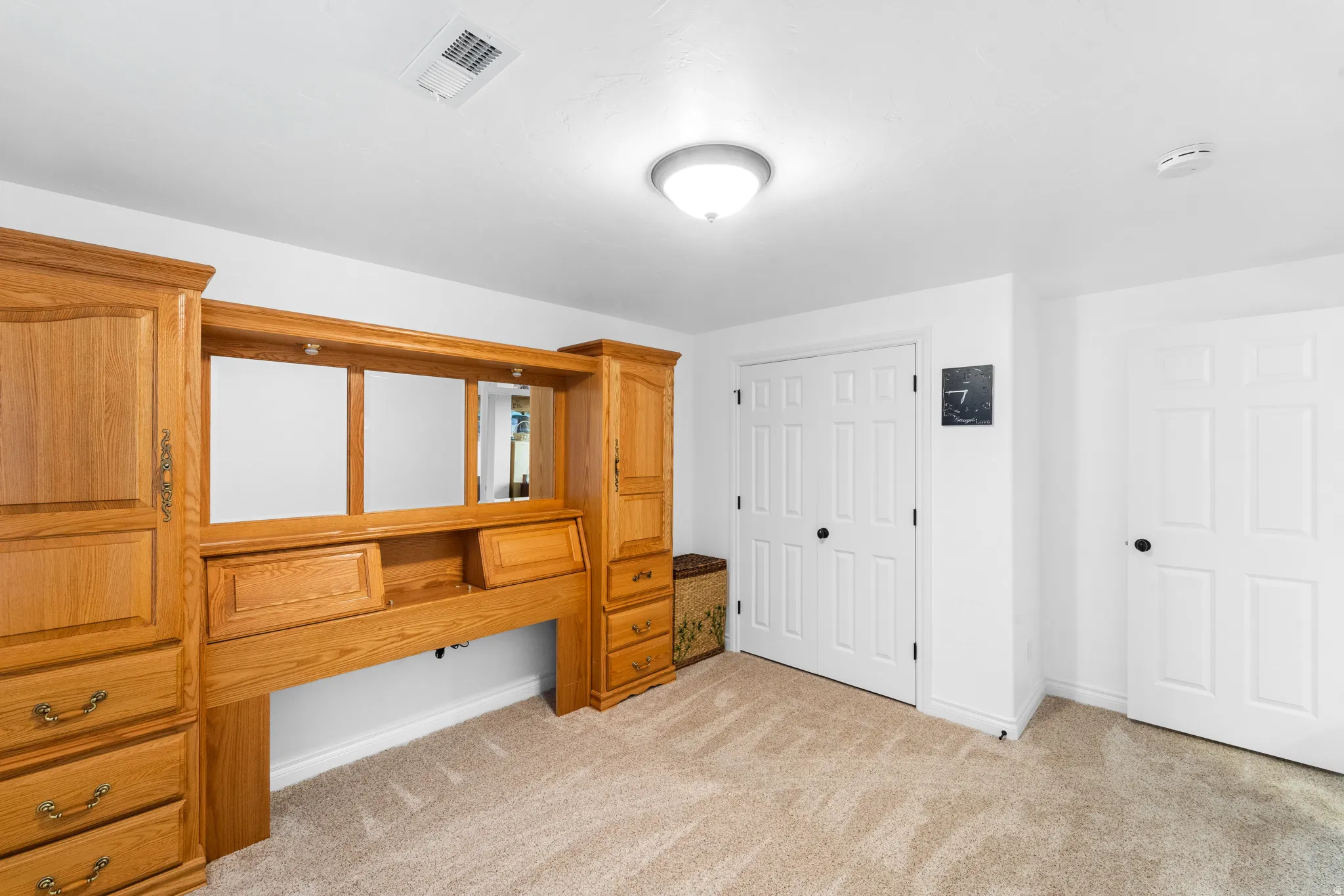 Built-in wood cabinetry with integrated shelving and drawers