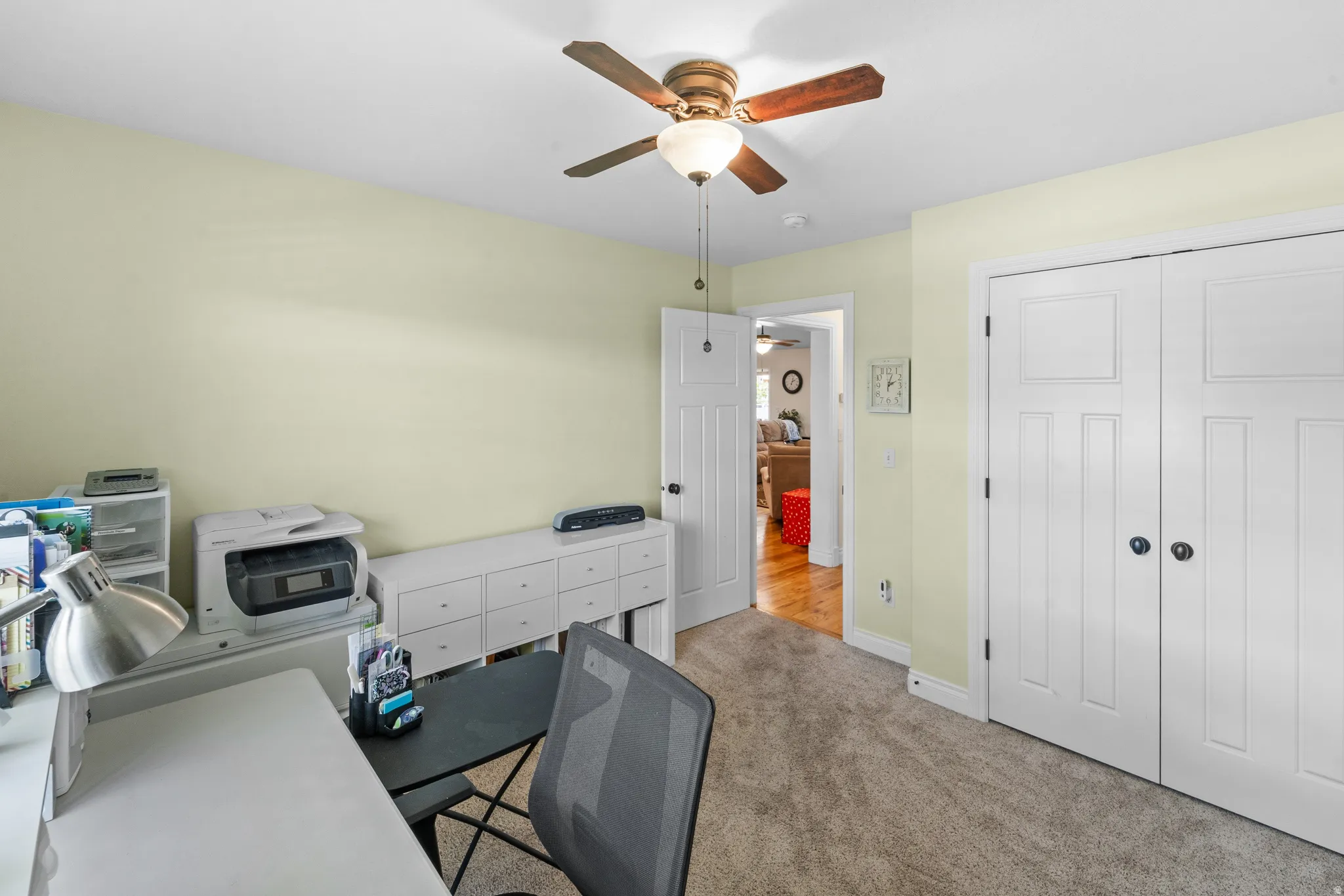 Light-colored wall paint and neutral carpet flooring