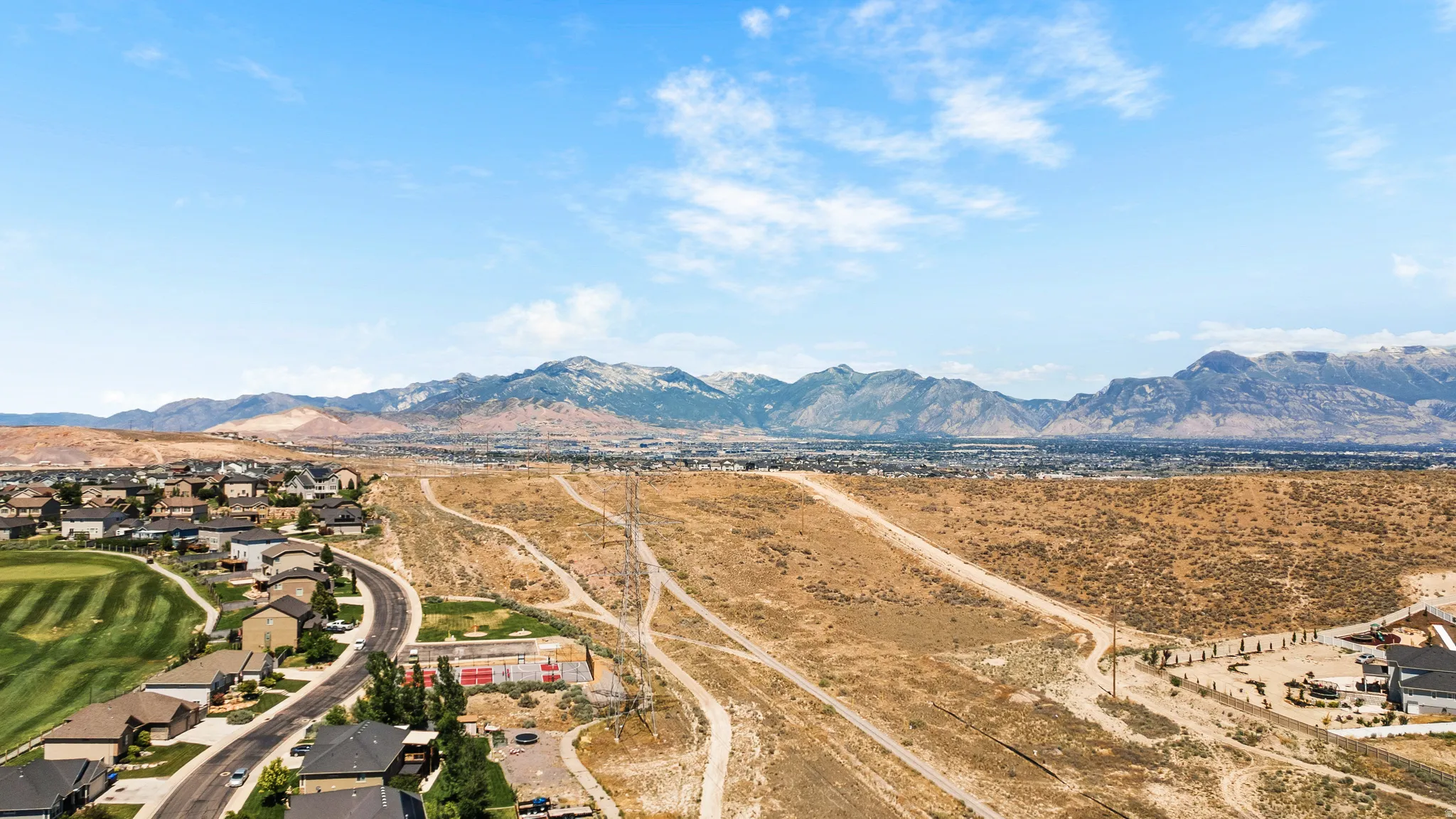 Expansive regional scenery featuring distant mountains