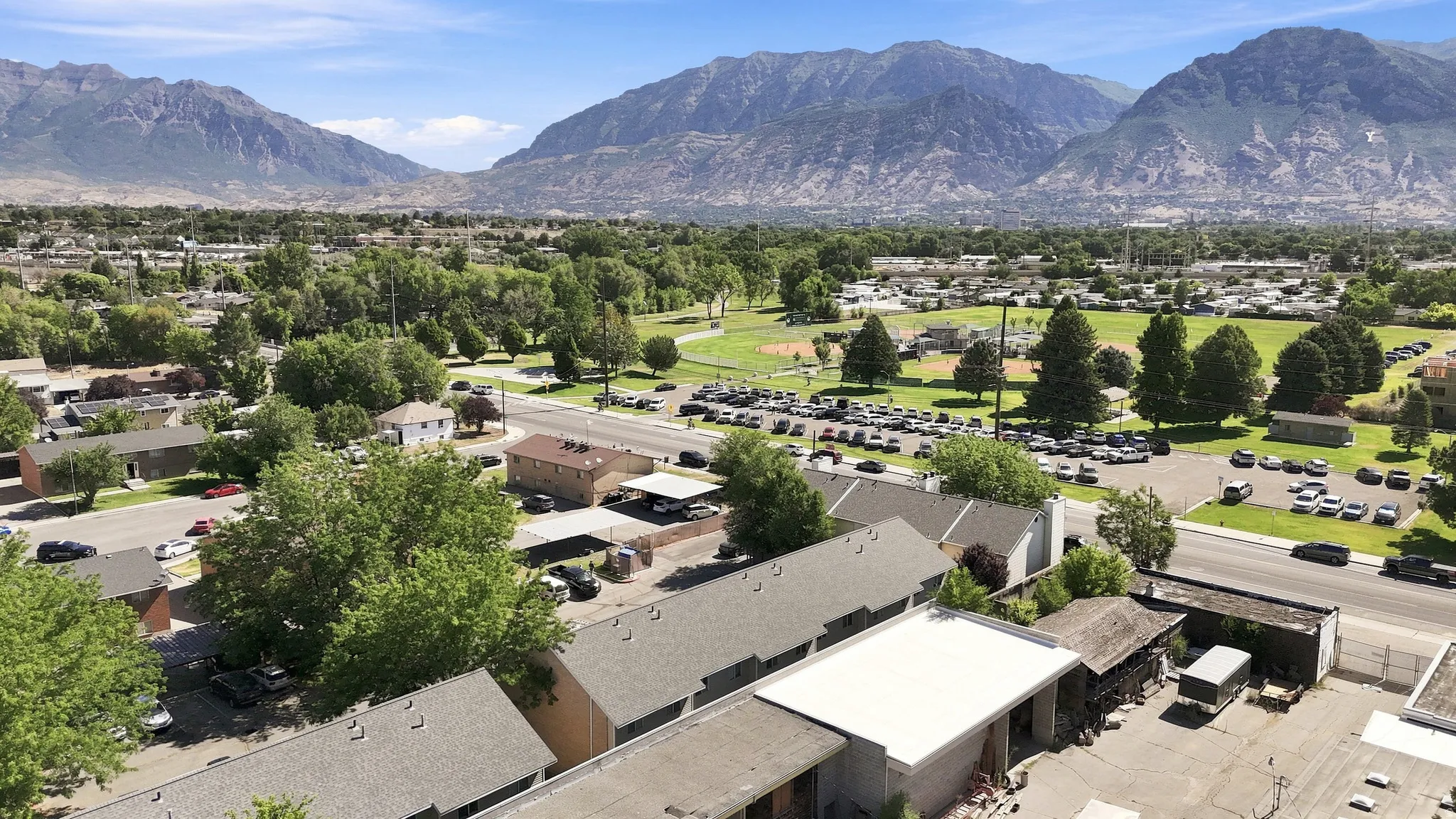 Expansive mountain backdrop with scattered residential structures