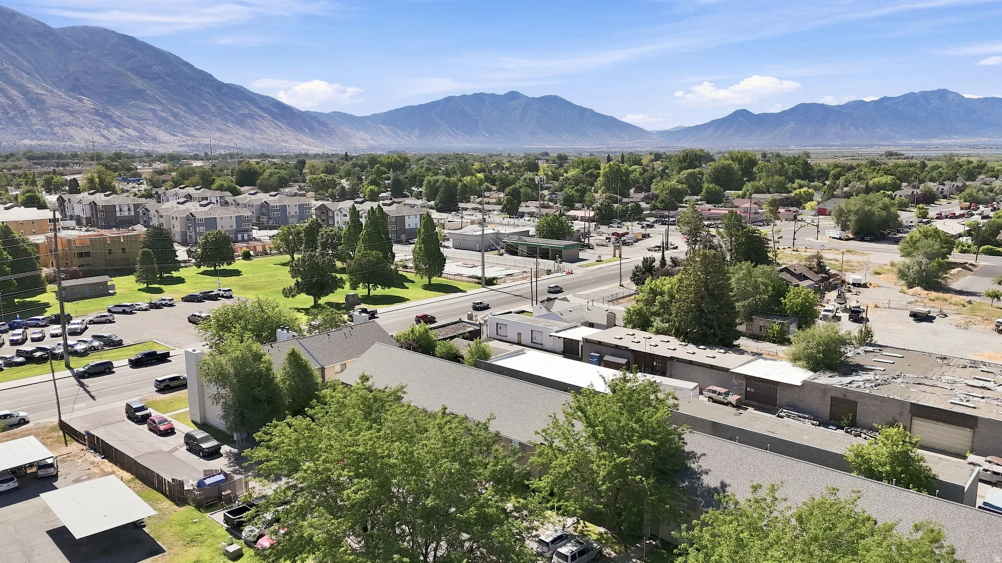 Expansive property featuring multiple structures and ample parking space