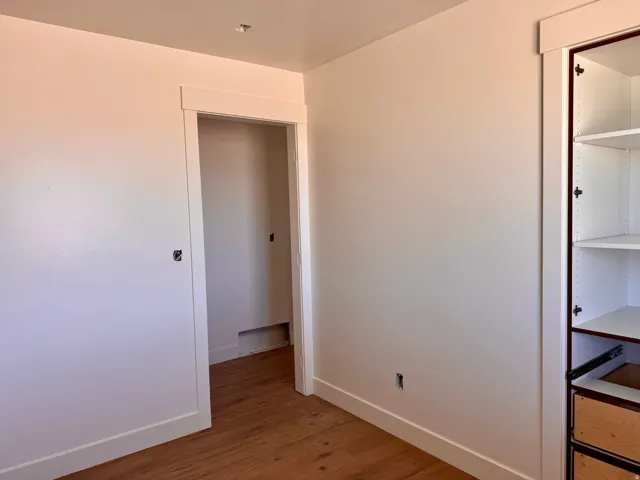 Wood-finish flooring with white wall finishes