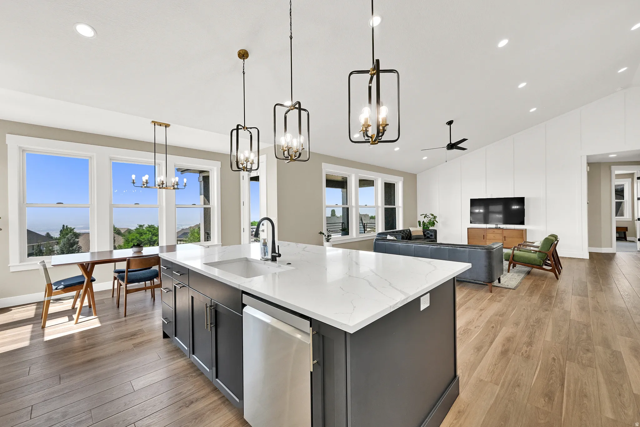 Open-concept living space with wood-finish flooring
