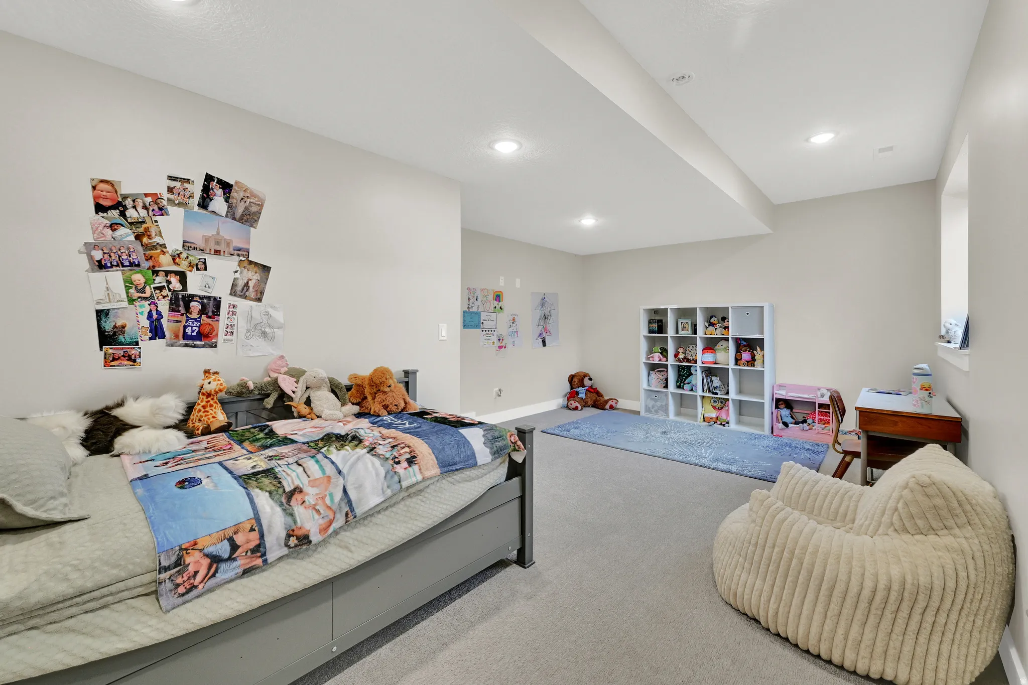 Carpeted room featuring a window, recessed lighting, and neutral wall paint