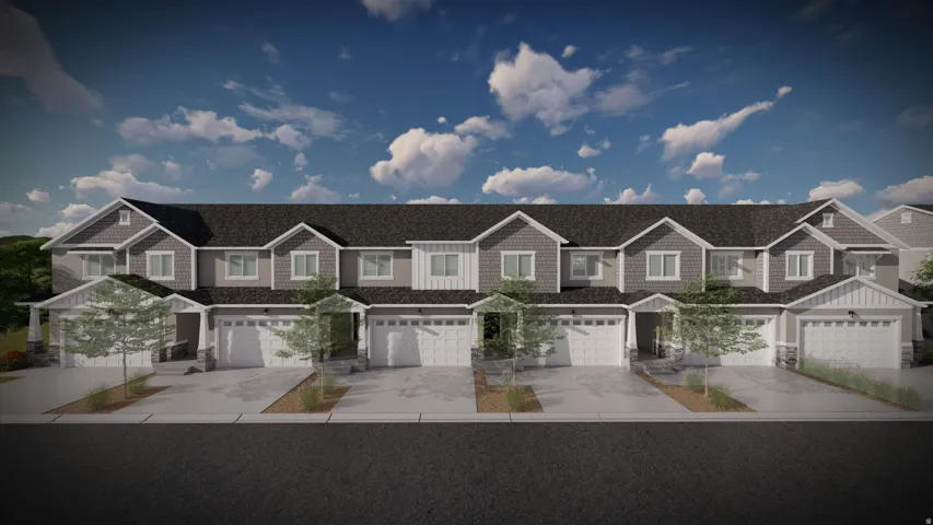 Contemporary townhome facade featuring a blend of gray siding and white trim