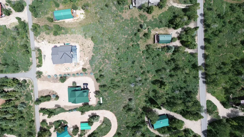Expansive land parcel featuring multiple structures and significant undeveloped acreage