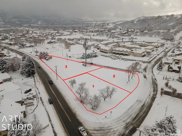 Expansive land parcel featuring direct road frontage and three distinct sections