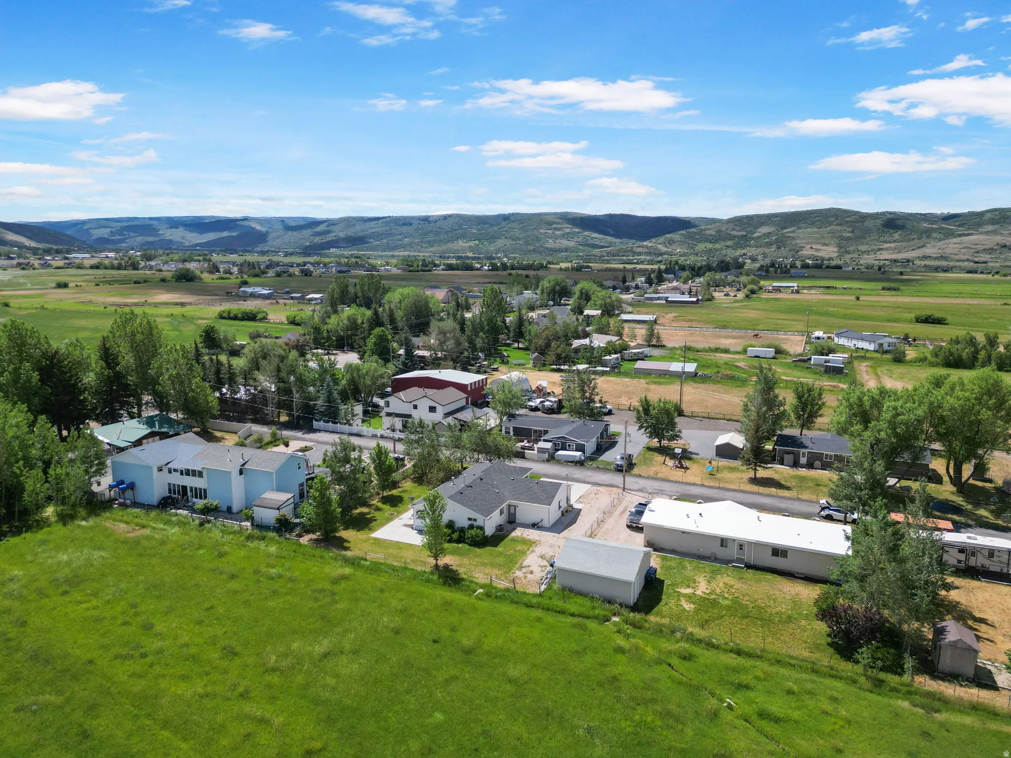 Expansive green space and a backdrop of distant hills