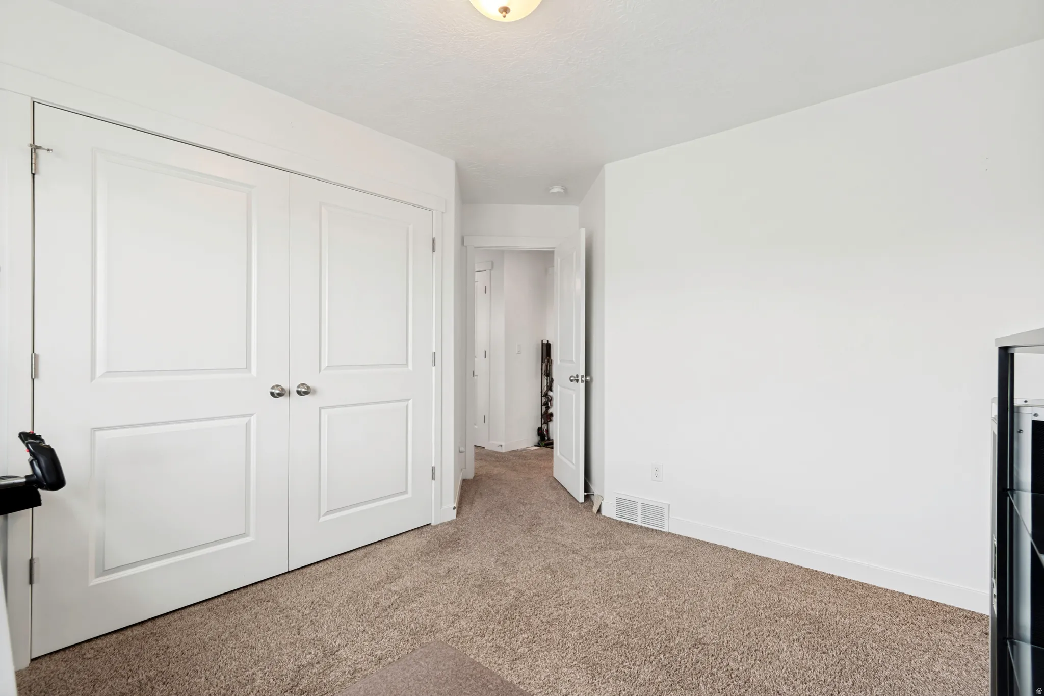 Neutral carpeting with crisp white walls and trim