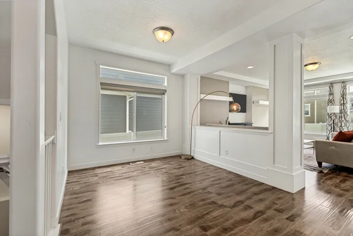 Interior space featuring wood-finish flooring and white baseboards
