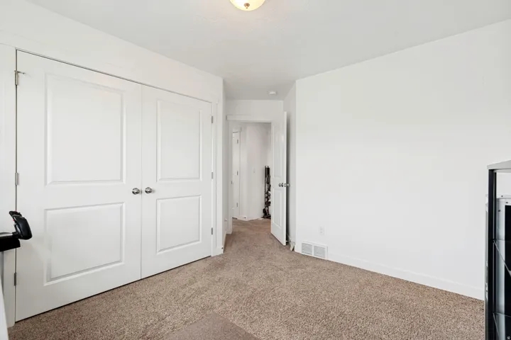 Neutral carpeting with crisp white walls and trim
